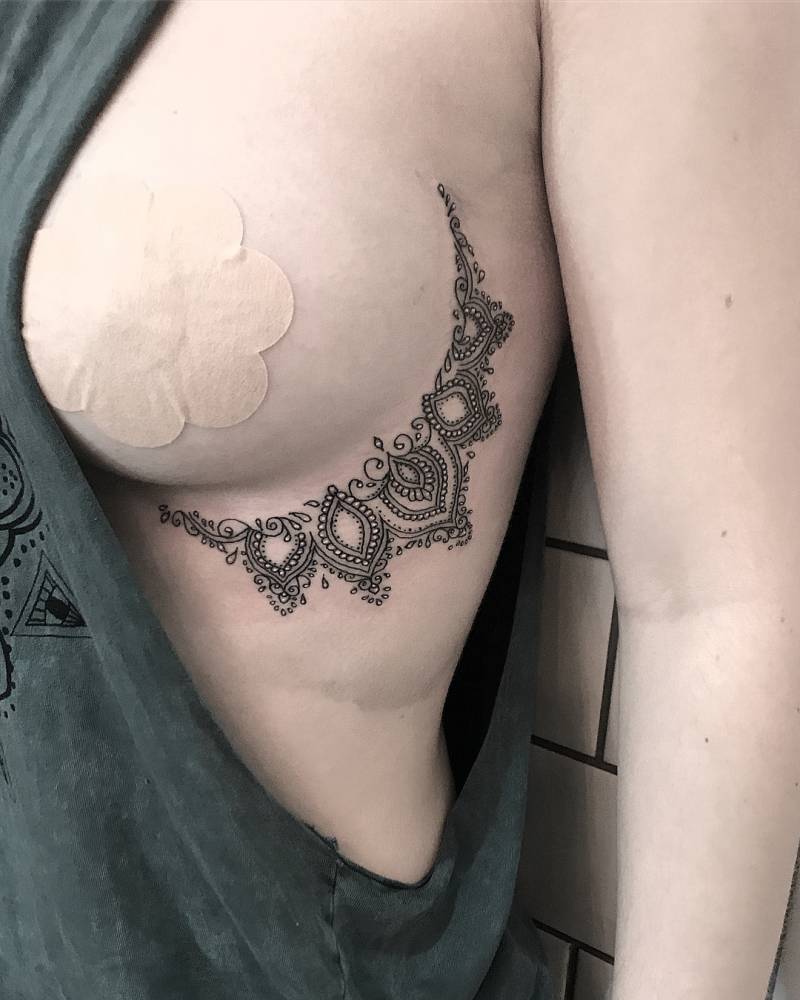 Showing tattoo on boob