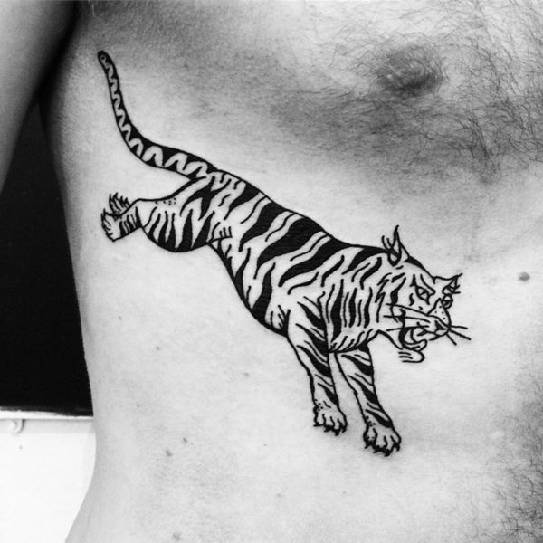 blackwork traditional tiger tattoo on ribs