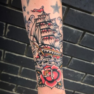 Sailboat & Rose tattoo on arm