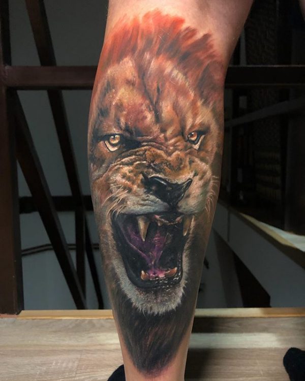 roaring lion tattoo forearm